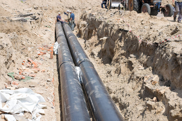Laying of large-diameter pipes to replace the heating main - Photo, Image