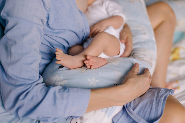 close up of a baby boy and mom holding his newborn son - Фото, зображення