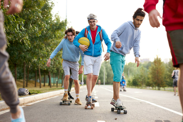 urban teen boys on skateboards - Fotó, kép