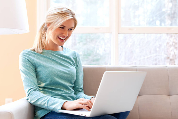 Young woman using her laptop - Photo, image