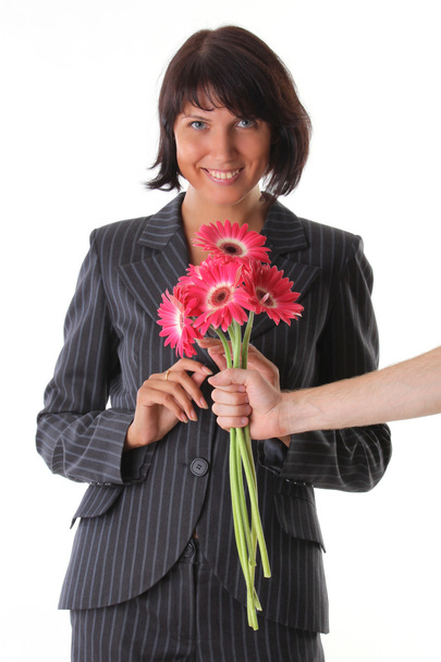 Surprise - delight woman and male hand with flower - Foto, imagen
