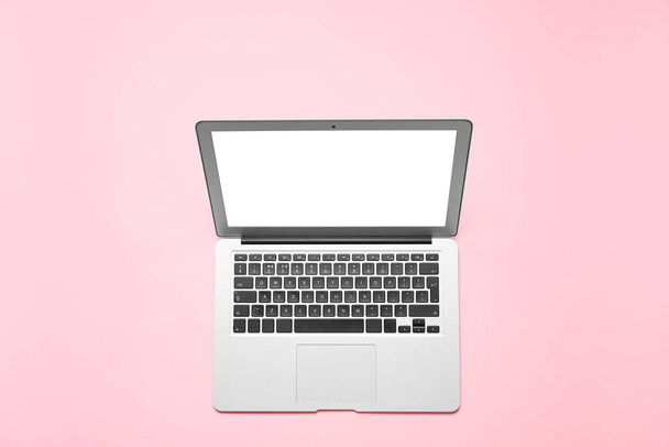 Modern laptop on color background - Fotó, kép
