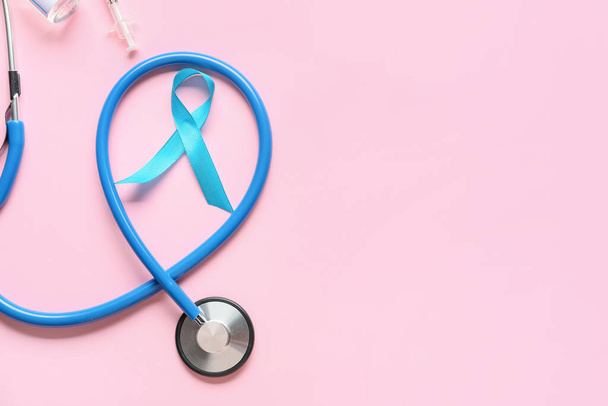 Awareness ribbon with stethoscope on color background. Diabetes concept - 写真・画像
