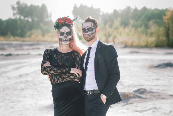 Evil day of the dead undead couple posing, halloween make up - Photo, Image
