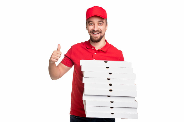Cheerful courier approving pizza delivery service - Foto, Bild