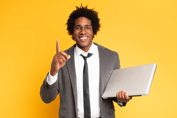 young black businessman with a laptop - Фото, зображення
