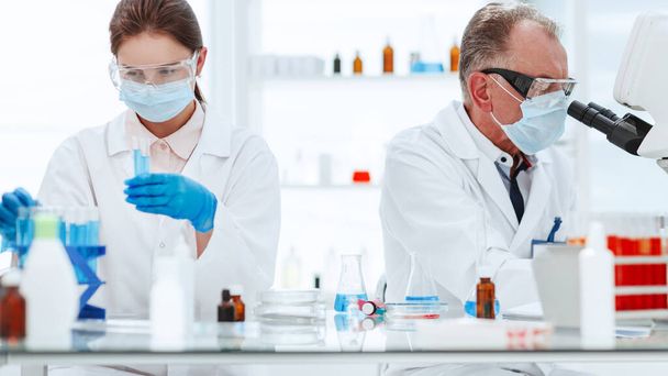 employees of the medical laboratory conduct blood testing . - Фото, зображення