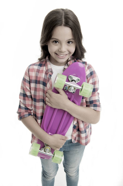 penny board girl. girl with penny board. hipster child hold skate penny board. penny board in hands of happy girl. carefree day. - Фото, изображение