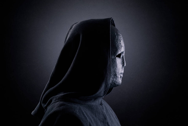 Portrait of a scary figure in hooded cloak - Фото, зображення