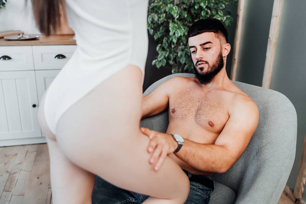 Man looks at a sexy woman and expects passionate sex. - Fotó, kép