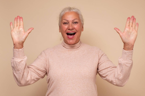 Senior caucasian woman is happy and shows ten fingers - Фото, зображення