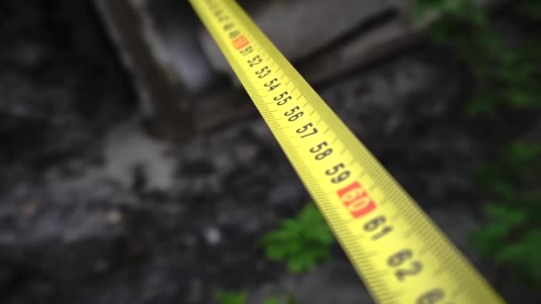 measuring yellow tape measure - Footage, Video