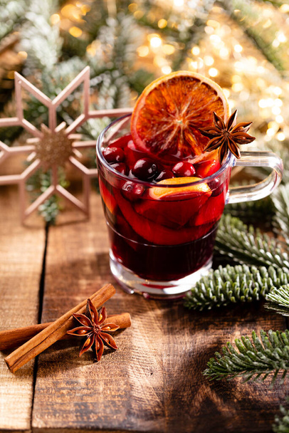 Christmas mulled wine with spices on a wooden rustic table. - Zdjęcie, obraz