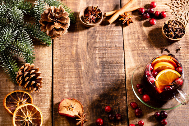 Christmas mulled wine with spices on a wooden rustic table. - Φωτογραφία, εικόνα