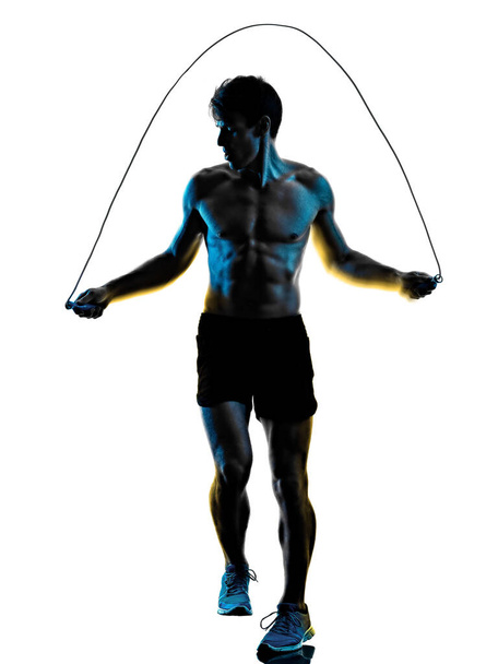 young man fitness exercise exercIsing shadow isolated white background silhouette - Foto, Bild