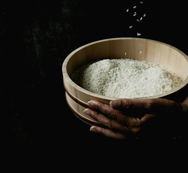 pouring; minimalistic; copy space; selective focus; side view; female; hands; round; ethnic; hanghiri; wooden; oriental; bowl; japanese; food; asian; ingredient; organic; heap; vegetarian; uncooked; cereal; dry; raw; natural; grain; pile; chinese; he - Photo, Image