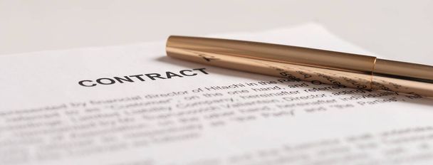 golden pen on the contract papers close up, banner. - Foto, Bild