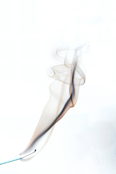 Clouds of smoke from a candle on a light background - Photo, Image