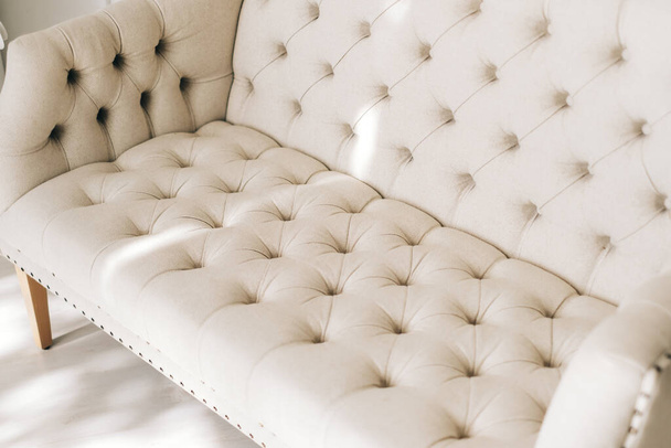White textile comfortable sofa in elegant living room. Close-up. High quality photo - Foto, Imagen
