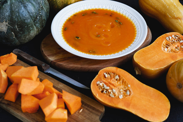 Close up photo of pureed pumpkin soup with pumpkin seeds - Фото, изображение