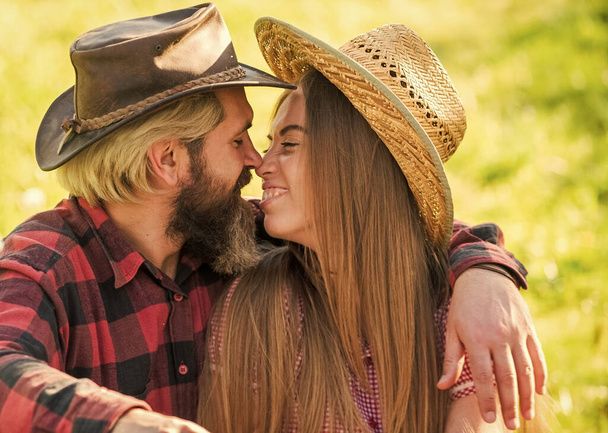 Falling in love. Bearded man hug sensual girl. Couple in love on summer landscape. Enjoying romantic relationship. Love and romance. Romantic love lasts forever - Photo, Image