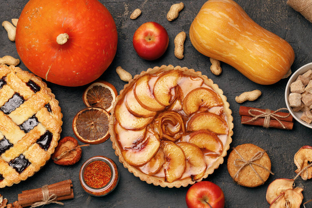 Berry tart pie and apple tart pie on black background - Foto, Bild