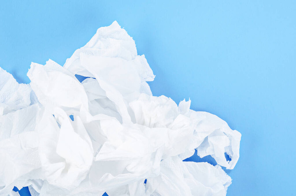 Crumpled tissue paper on blue background. - Fotografie, Obrázek