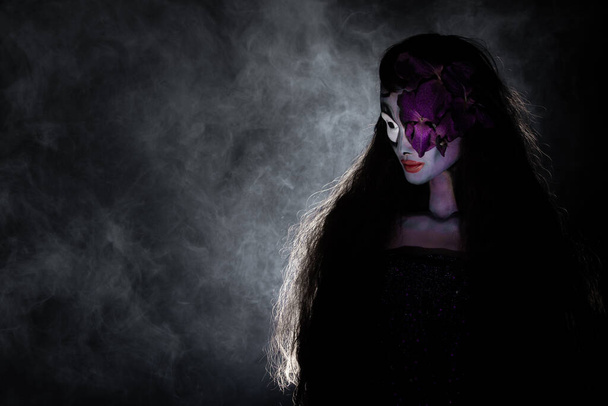 Ghost skull Doll woman with purple skin curl long hair of Haunted places, halloween background empty copy space - Fotó, kép
