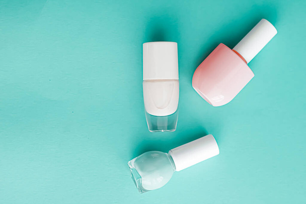 Nail polish bottles on green background, beauty brand - Photo, Image