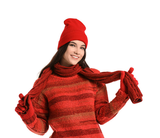 Beautiful young woman in winter clothes on white background - Foto, imagen