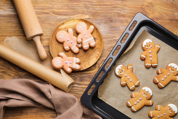 Composition with tasty gingerbread cookies on wooden background - 写真・画像