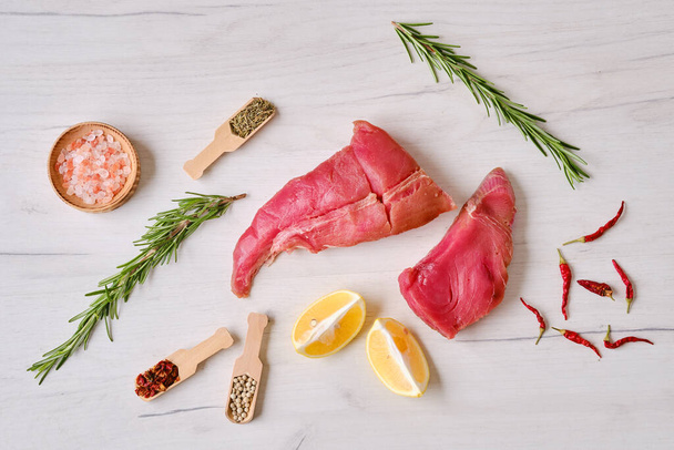 Raw fresh pieces of tuna fillet with spice - Фото, изображение