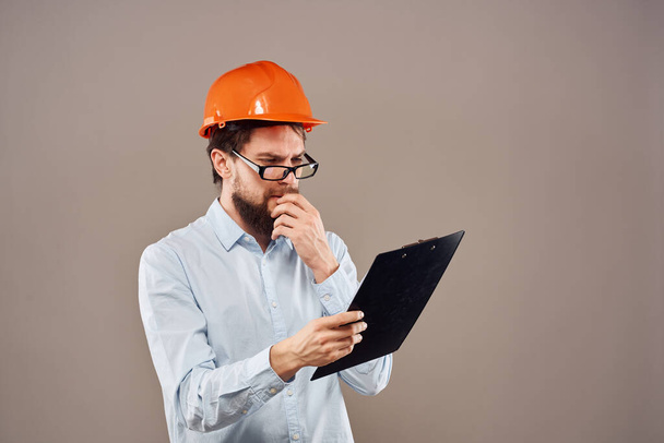 Engineer orange helmet work construction operation manual - Zdjęcie, obraz