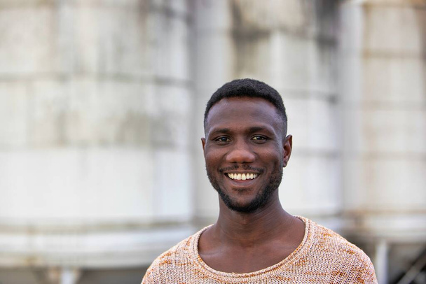 Young black man smiling at camera. Portrait. Medium shot.  - Fotoğraf, Görsel