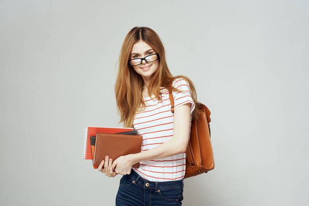 female student with notepad and backpack on back cropped view education science glasses - Photo, Image