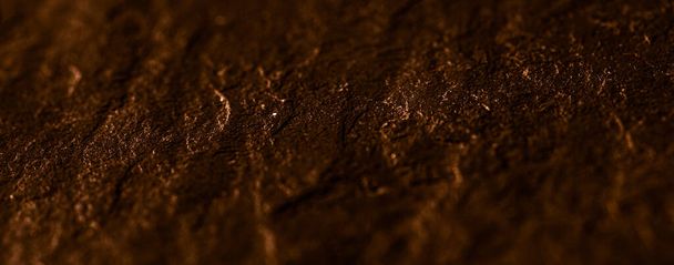 Textura de piedra marrón como fondo abstracto, material de diseño y superficie texturizada - Foto, imagen