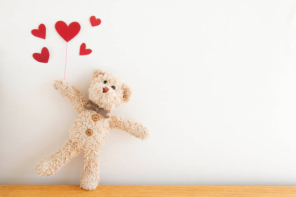 Cute teddy bear with red heart balloons, Be happy and smiling, Happy Valentine's day concept. - Photo, Image