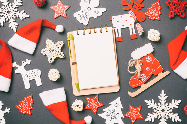 Top view of notebook. New Year decorations on black background. Merry Christmas concept. - Fotoğraf, Görsel