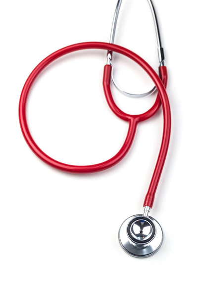 Red stethoscope on white background  - Foto, afbeelding