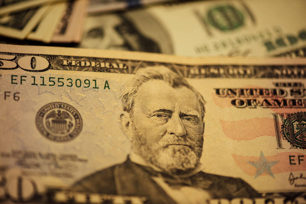 Dollars different bills. Dollars background. Background of different us dollar banknotes. Finance concept. - Photo, Image