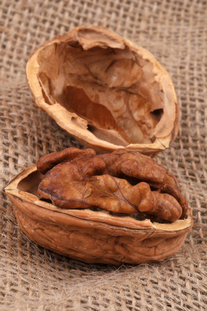 Walnut kernel close-up on a burlap  - Photo, Image