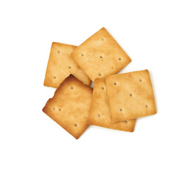 biscuits croustillants carrés cuits au four isolés sur fond blanc, vue de dessus - Photo, image