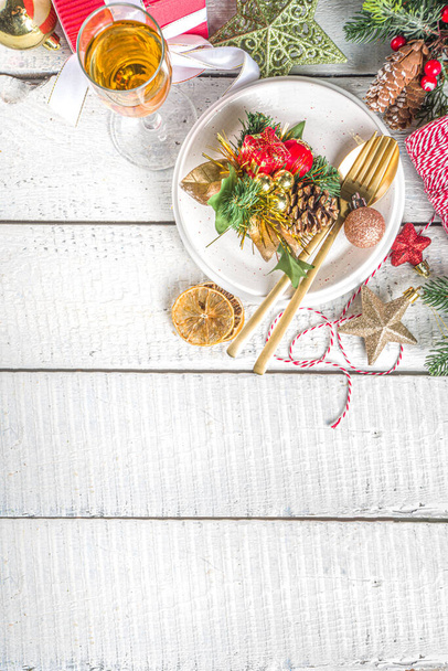  Christmas or New Year table setting. Place setting for Christmas Dinner with Xmas Holiday Decorations - Photo, Image
