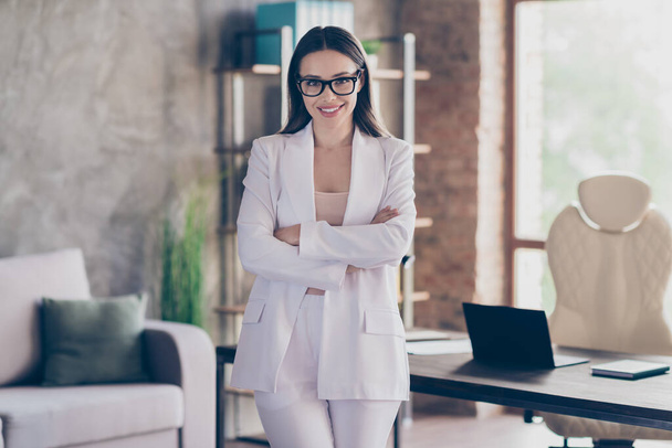 Portrait of her she nice-looking attractive pretty cheerful lady qualified shark investor real estate agency owner folded arms at modern industrial loft brick interior workplace workstation - Foto, Imagen