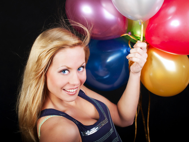 Smiling woman on party holding ballons - Foto, imagen