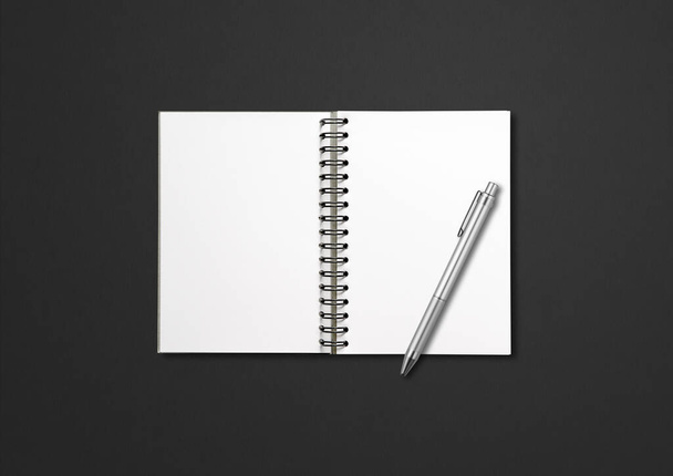 Blank open spiral notebook mockup and pen isolated on black background - Fotó, kép