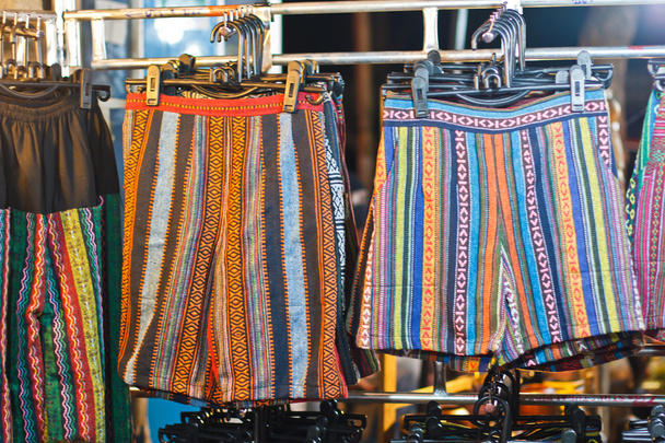 зображення барвистого текстильного тла, купа яскраво складеної тканини
 - Фото, зображення