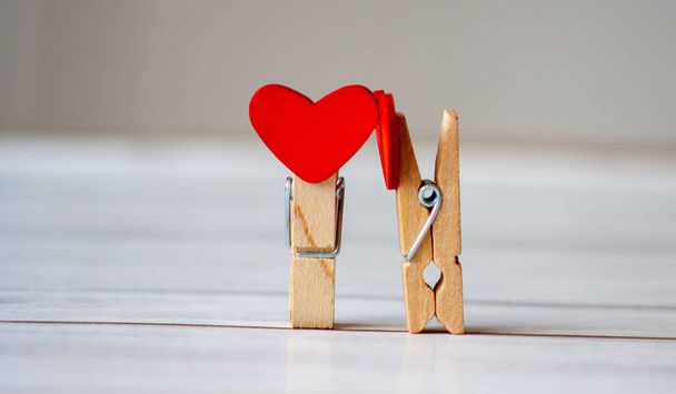 Couple clothes pin as love romantic concept. Romance and valentines day background. Wedding time. - Фото, зображення