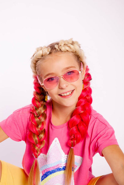 girl in bright colorful clothes and with colored braids - Fotografie, Obrázek