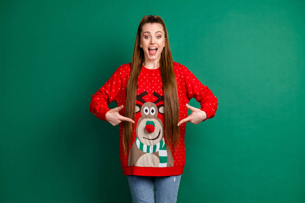 Portrait of her she nice-looking attractive pretty charming cheerful cheery long-haired girl demonstrating wearing cosy casual festal look deer print isolated over green color background - Φωτογραφία, εικόνα